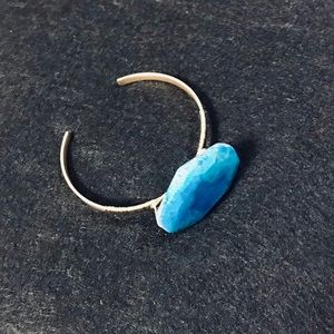 Handmade cuff bracelet with natural cut blue stone